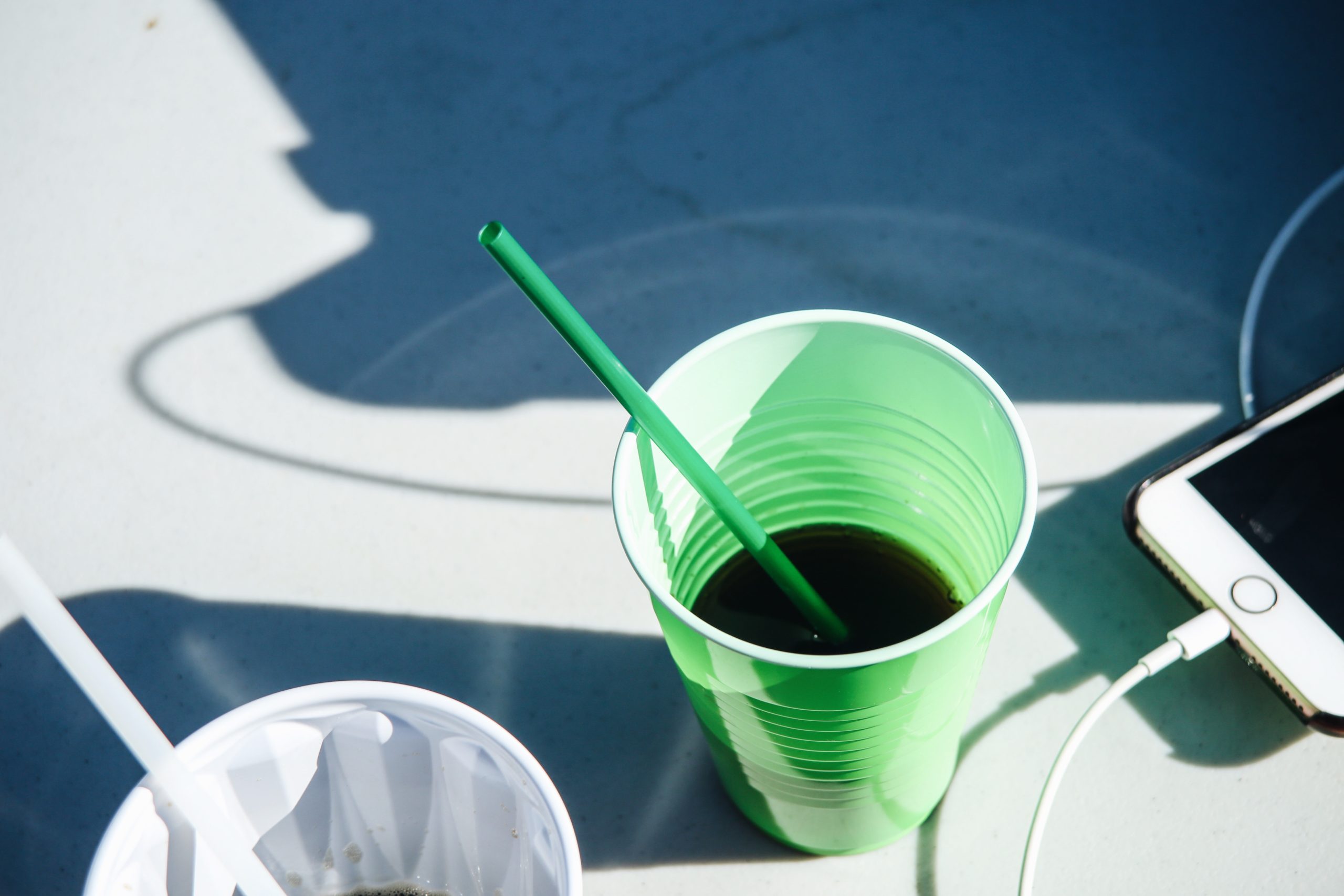 Drinking vegetable juice by the pool